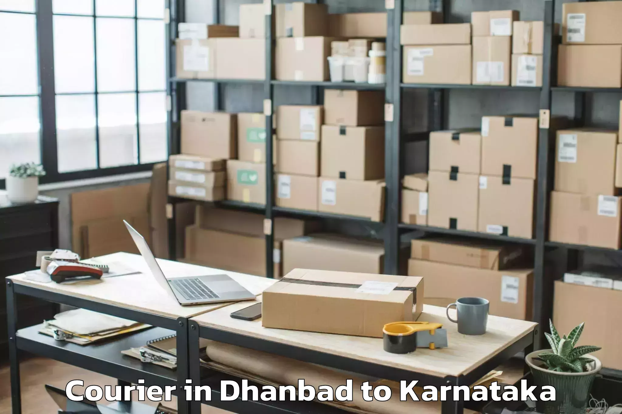 Easy Dhanbad to Karnataka Janapada Vishwavidya Courier Booking